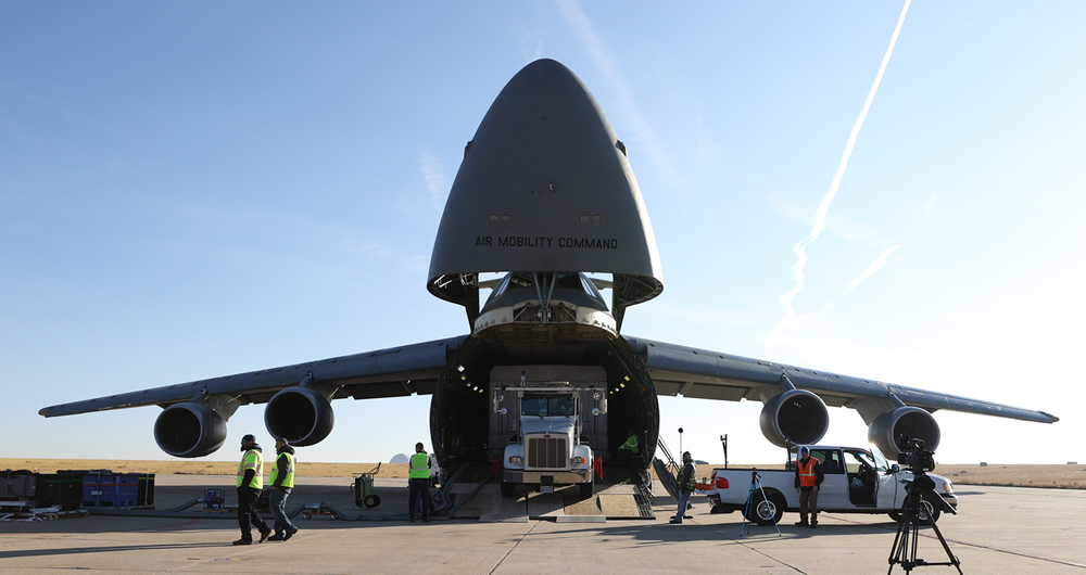 GOES-T being offloaded from a large transport plane